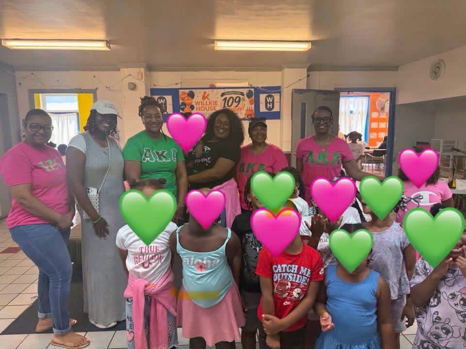Iota Zeta Omega members with children at Willkie House's 109th anniversary celebration