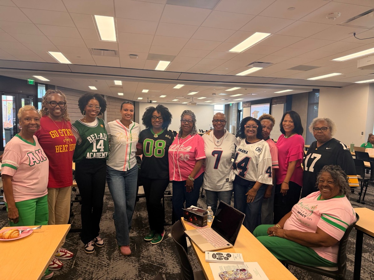 Sorors in sports jerseys at a chapter gathering
