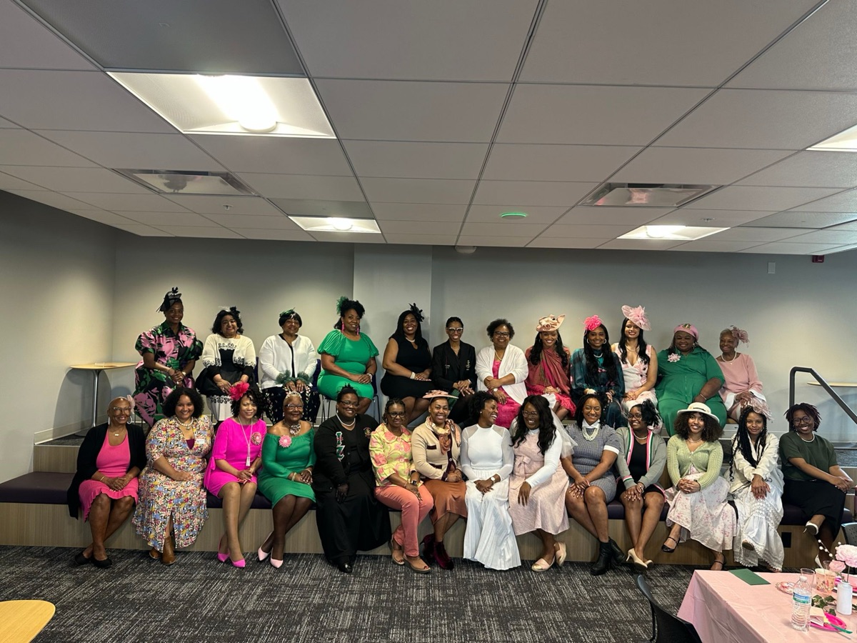 Sorors in hats and spring dresses at a tea